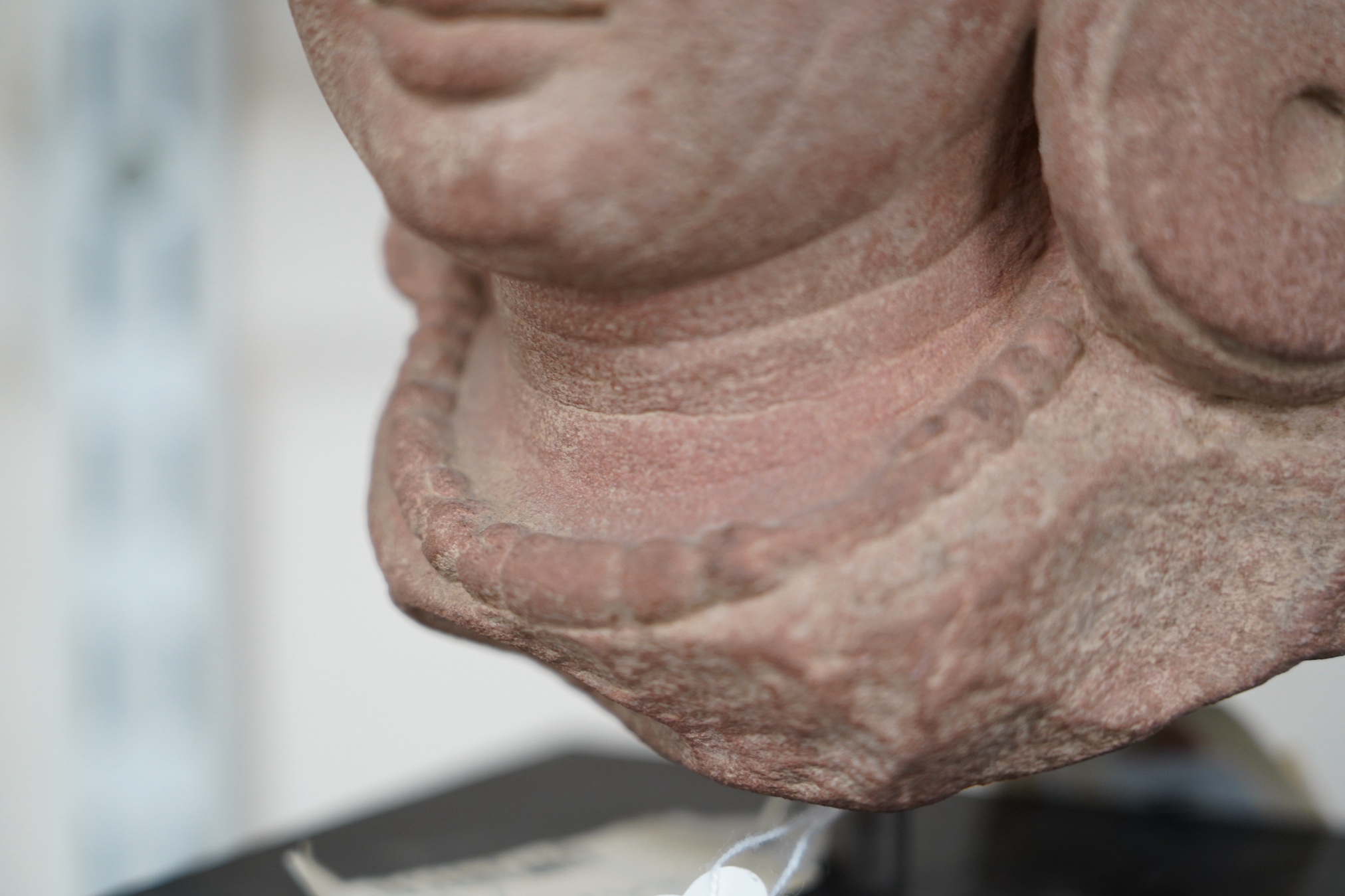 A red stone head of Ardhanarishvara, Muthura region, India, Gupta period, c.5th century A.D.